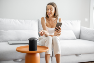 Woman interacting with an AI voice assistant.